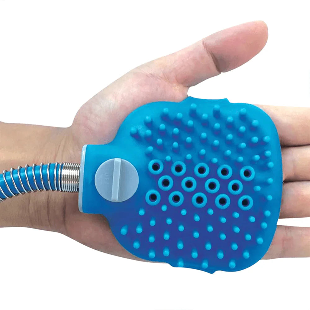 Blue silicone hand scrubber on a person's hand with a white background