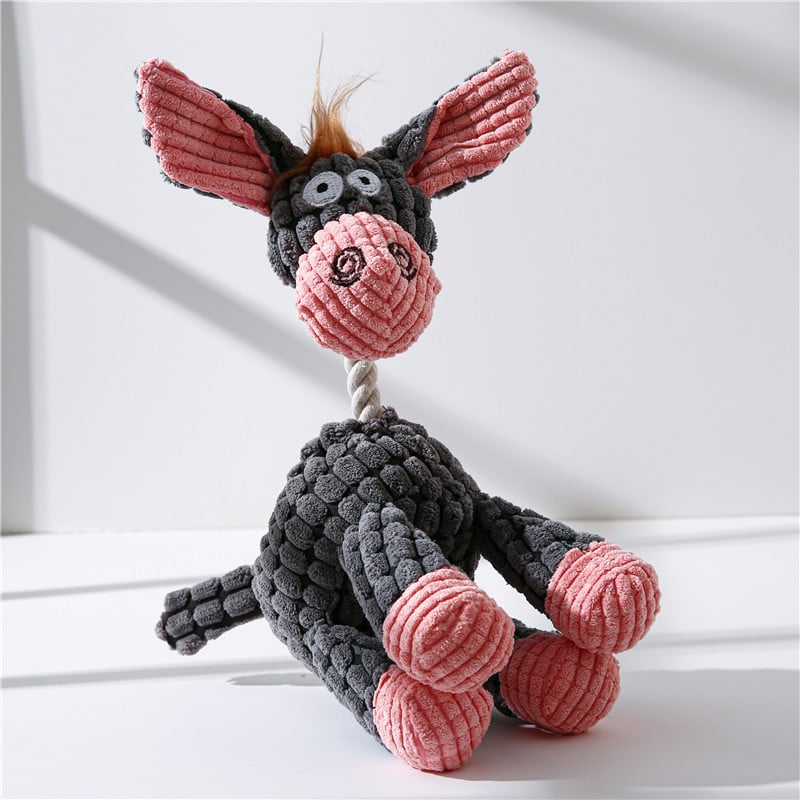 Knitted dog toy shaped like a donkey with pink ears and feet on a white background