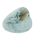 Fluffy turquoise cat bed on a white background