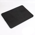 Black metal tray with ribbed design on a white background