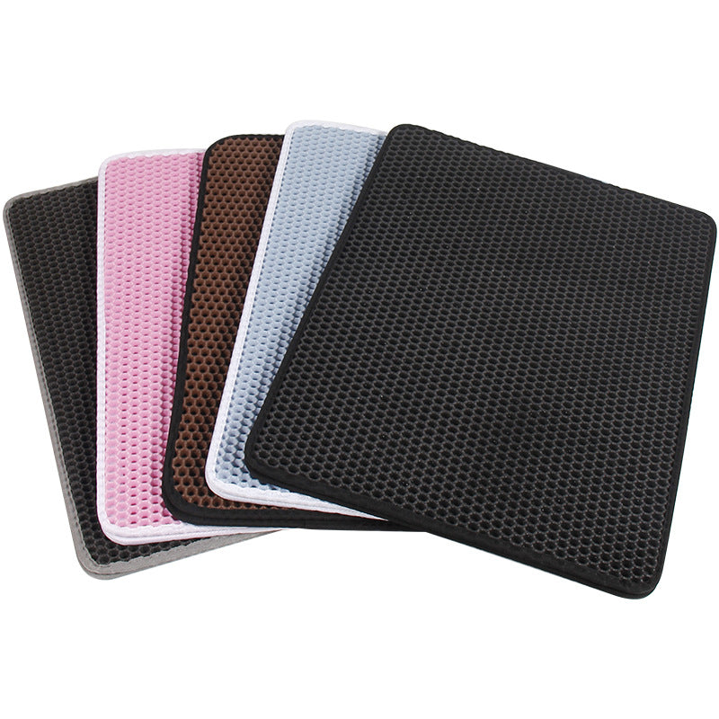 Set of four square coasters with honeycomb texture in black, pink, and gray on a white background.