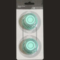 Two green charcoal filters in packaging with visible brand name.