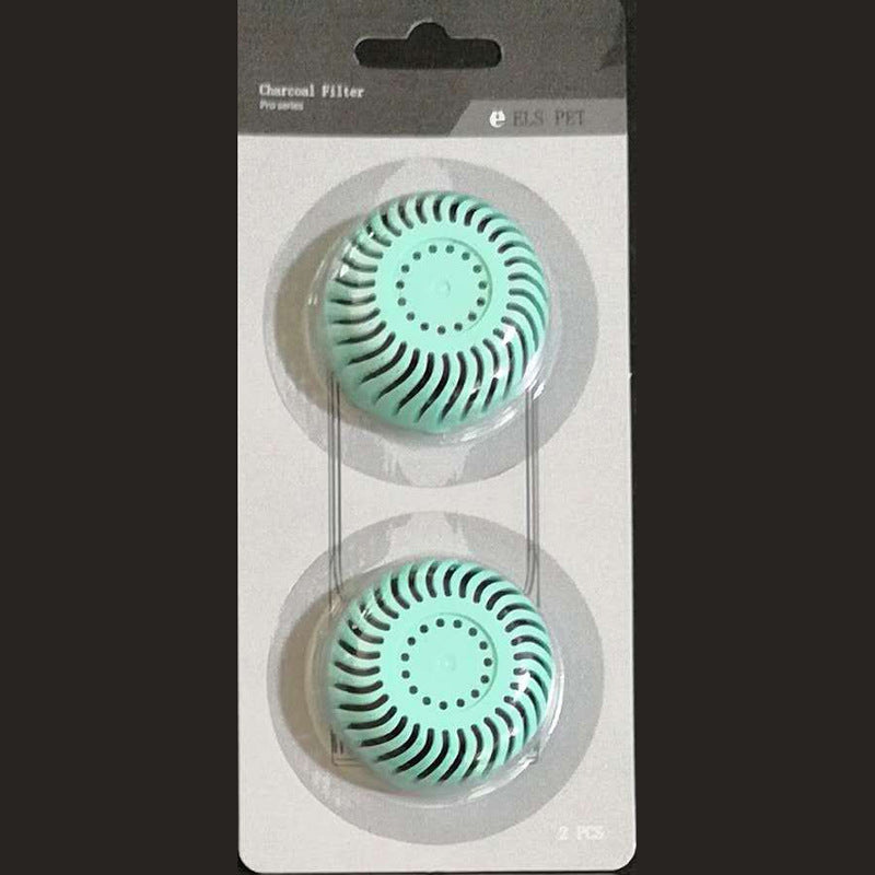 Two green charcoal filters in packaging with visible brand name.